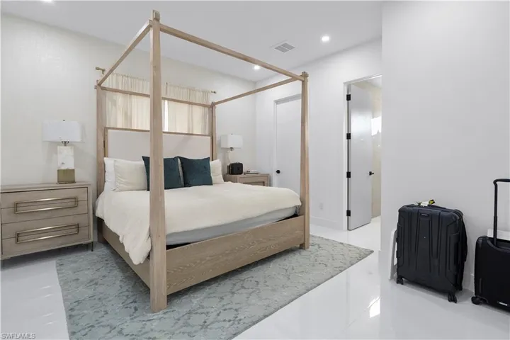 Bedroom with recessed lighting and light tile patterned floors