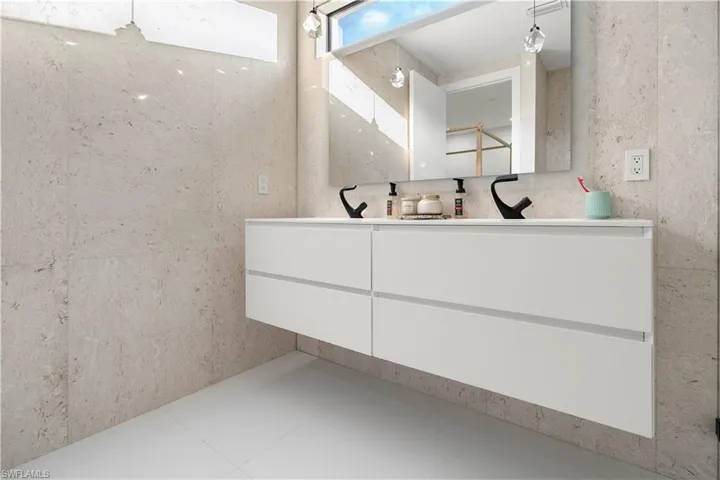 Full bathroom with double vanity