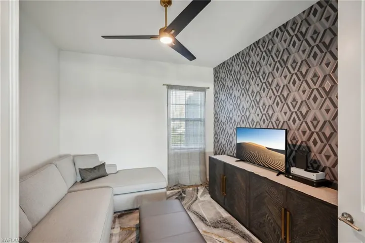 Living room featuring ceiling fan