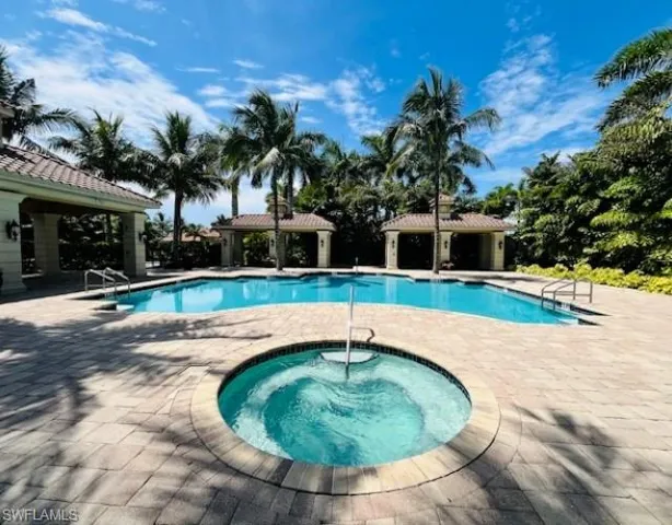 Community pool with a gazebo, a hot tub, and a patio