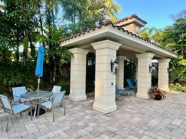 View of community with a patio area, outdoor dining area, and a gazebo
