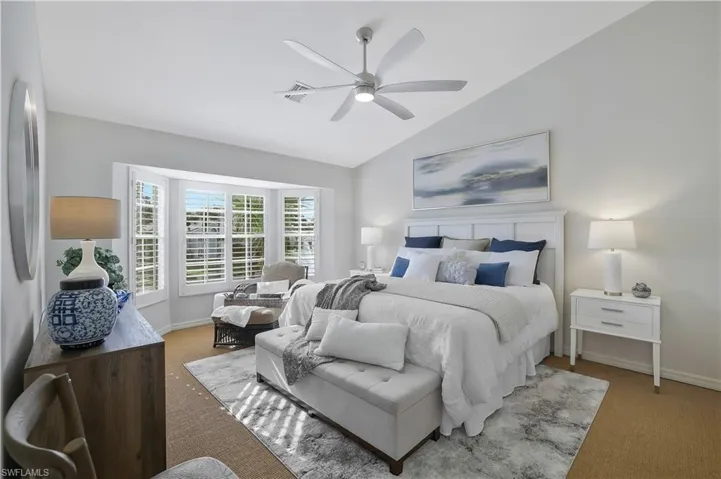 Primary bedroom with view over lake and fountain