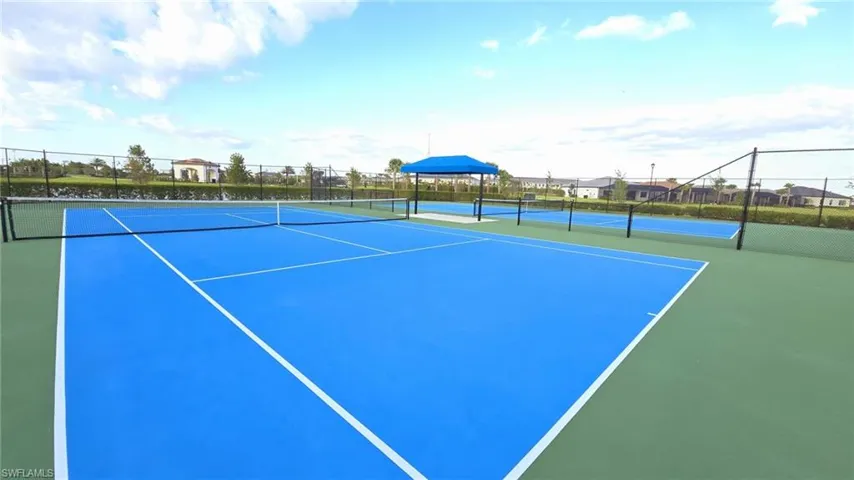 View of tennis court with fence