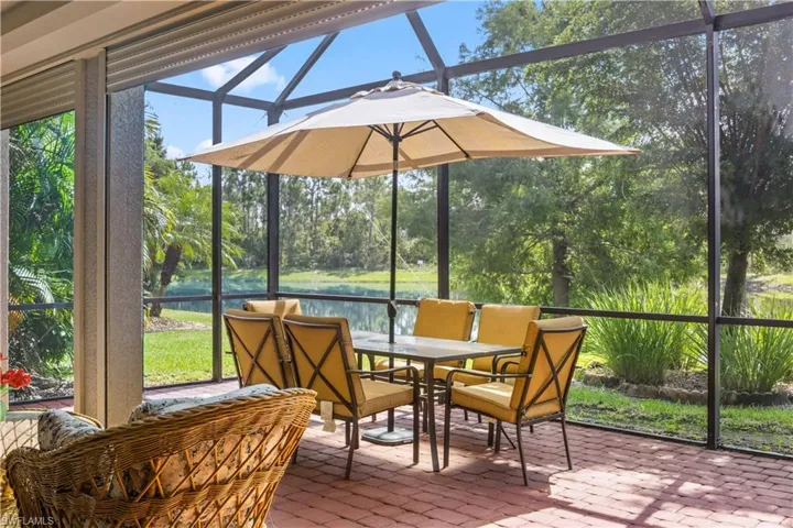 Enjoy peaceful lake views from your private, screened-in lanai.