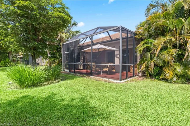 Surrounded by mature trees and landscaping, this backyard offers plenty of privacy and natural beauty.