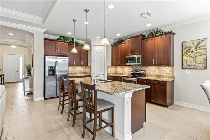 With an open layout, breakfast bar seating, and ample counter space, this kitchen is ideal for hosting and everyday cooking.