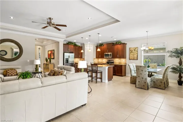 Open-concept kitchen, living, and dining areas showcase stunning lake views.