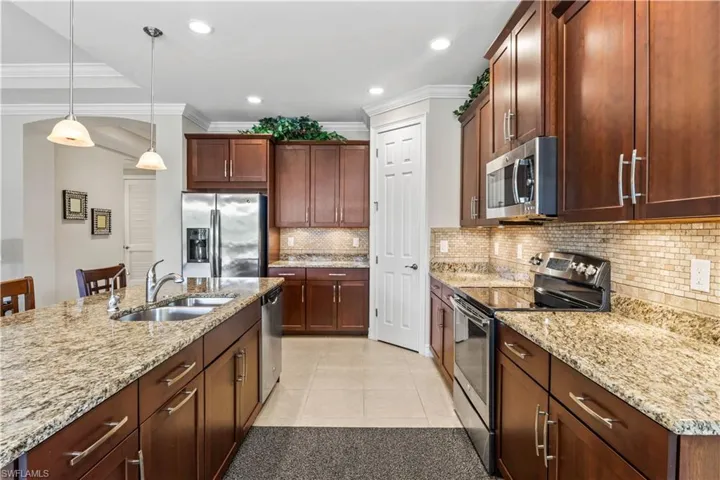 The kitchen offers a warm and functional space where friends and family naturally come together.