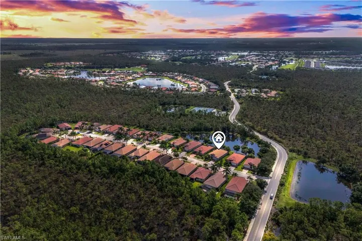 A breathtaking aerial look at Magnolia Landing, glowing under the Florida sunset.