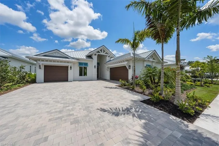 23517 Coconut Landing Drive is a Beach model, featuring a split 2car/1 car garage plan and just under 3200SFUA.