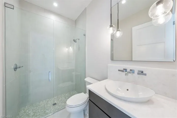 Bathroom 4 is tucked away just off of the office and serves as the guest bath just