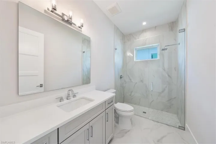 Bathroom 3 is adjacent to bedroom 3 and doubles as a convenient pool bathroom.
