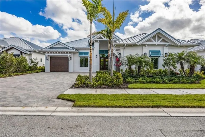 23517 Coconut Landing Drive is a Beach model, featuring a split 2car/1 car garage plan and just under 3200SFUA.