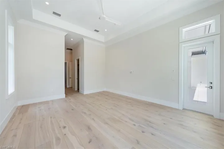 The primary bathroom sparkles with large scale polished tile, oversized dual vanities, soaking tub, and 5-fixture shower with bench and rain showers. A private water closet completes the bath.