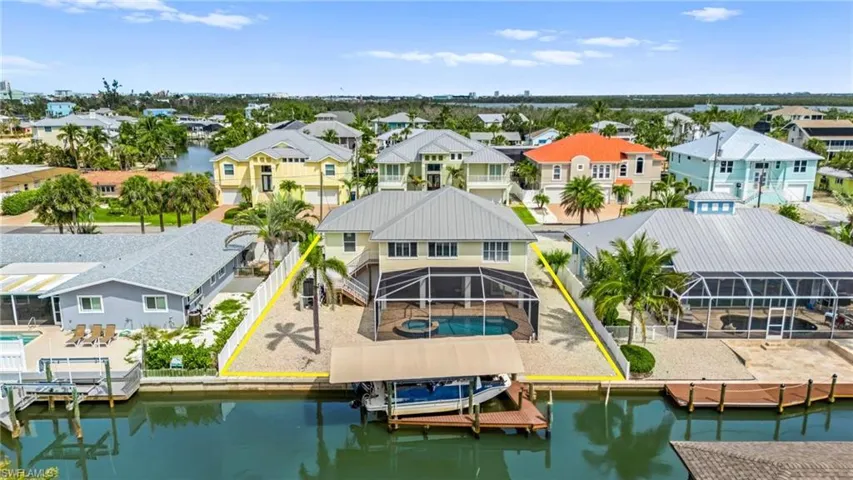 Aerial view of rear side of house- virtually enhanced