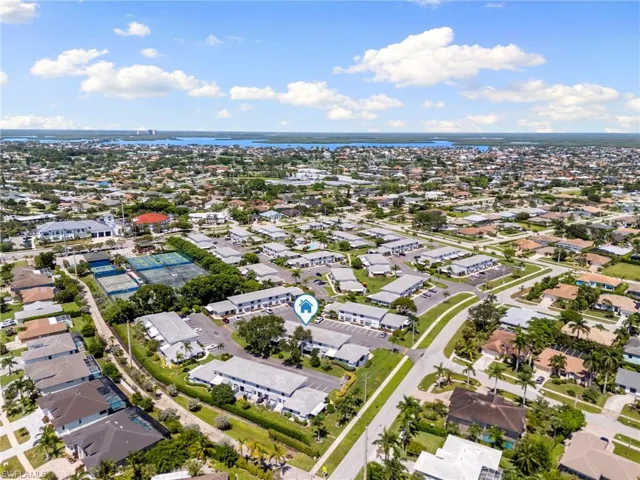 View of property location with nearby suburban area and a nearby body of water