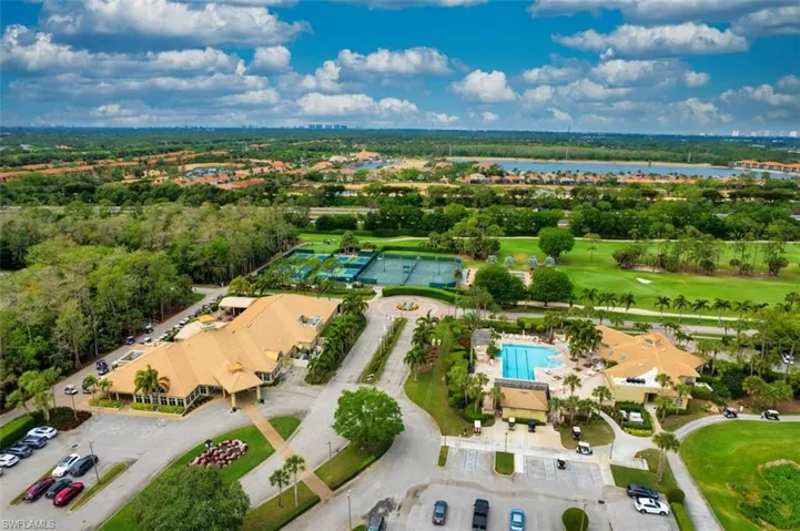 Aerial view featuring view of golf course and a water view