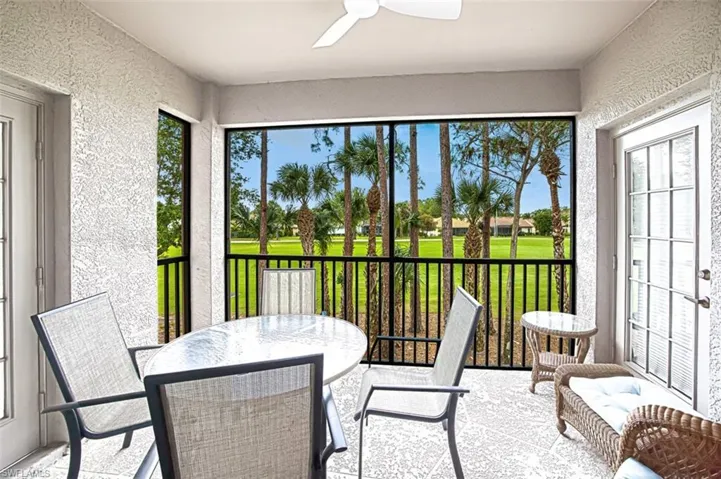 Sunroom / solarium featuring ceiling fan