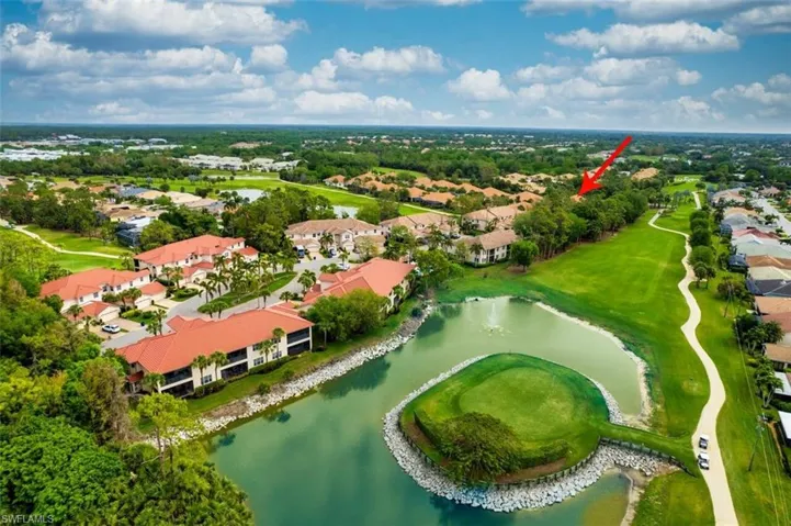Birds eye view of property with view of golf course, a water view, and a residential view