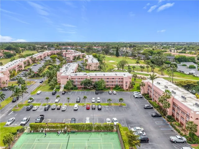 Bird's eye view of apartment complex / building and a golf club