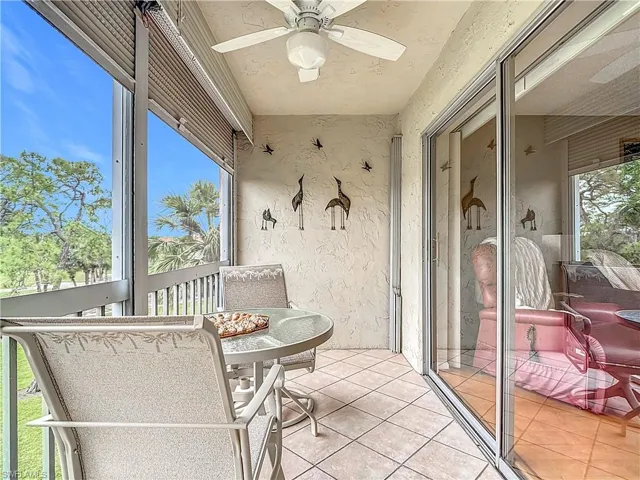 Sunroom / solarium featuring a ceiling fan