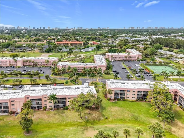 Drone / aerial view of a skyline view and apartment complex / building