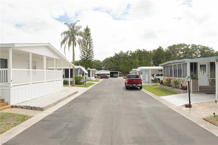 View of asphalt street featuring a residential view