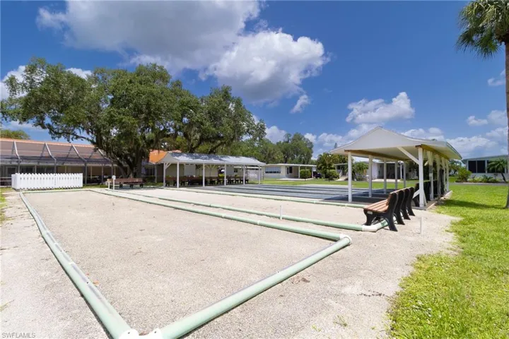 View of property's community featuring a game area
