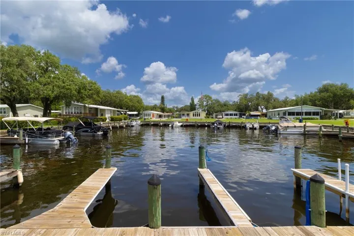 Dock featuring a water view and a residential view