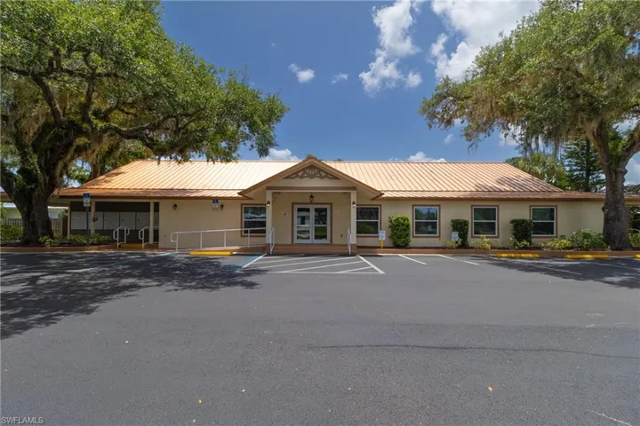 View of property with uncovered parking