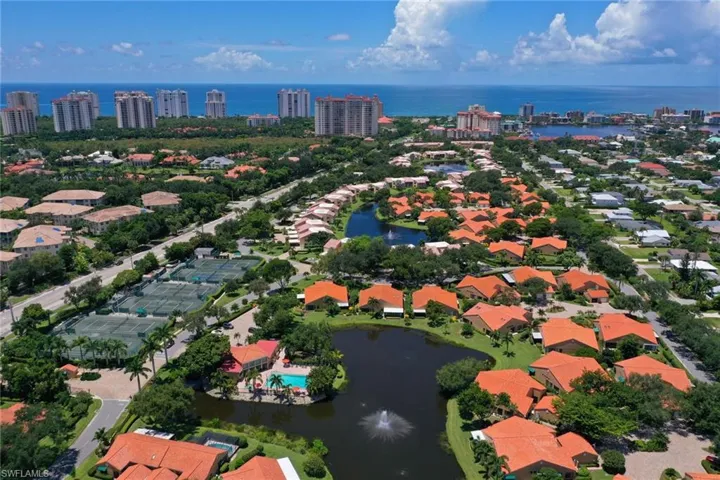 Birds eye view of property featuring a water view