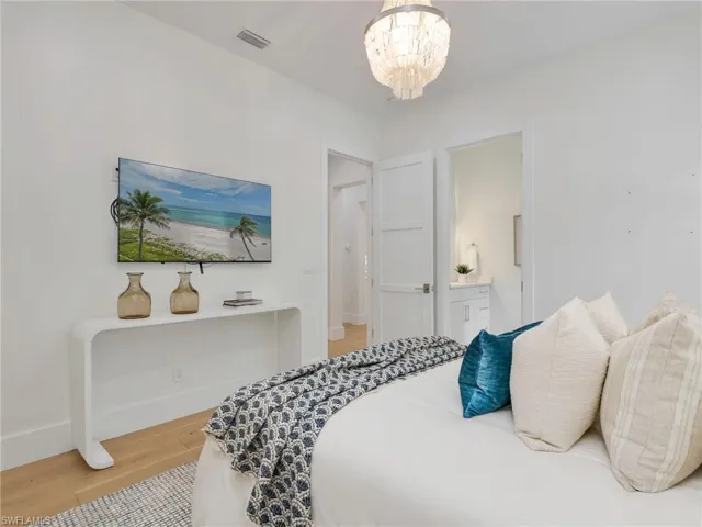 Wood-finish flooring with white baseboards throughout