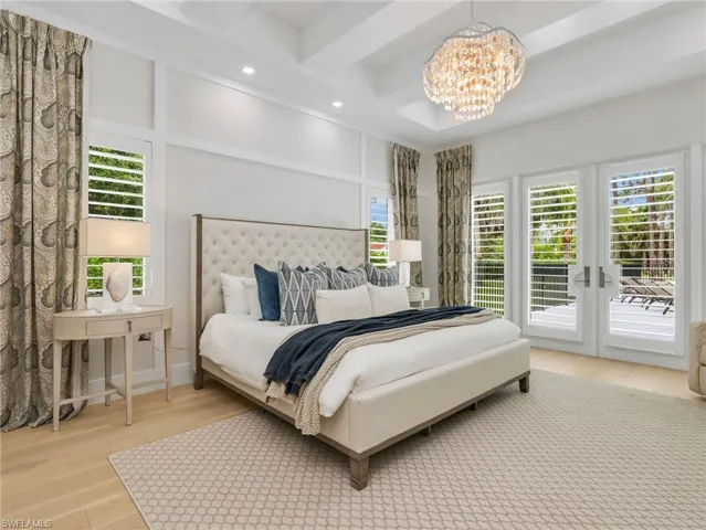 Custom window treatments, beautiful ceiling details with recessed lighting, and a decorative chandelier