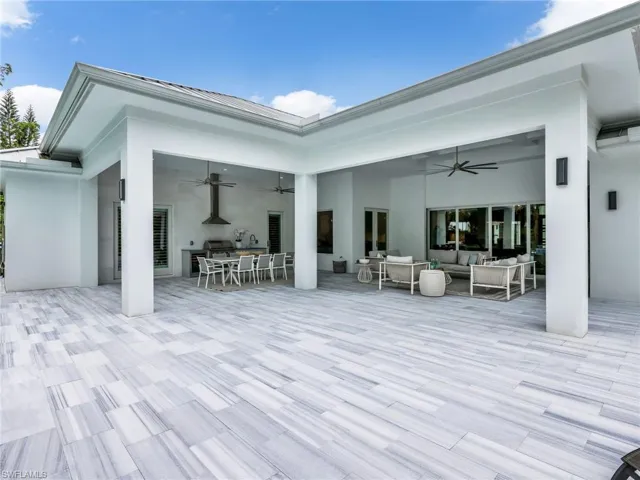 Expansive covered patio featuring Alfresco dining and large conversational area