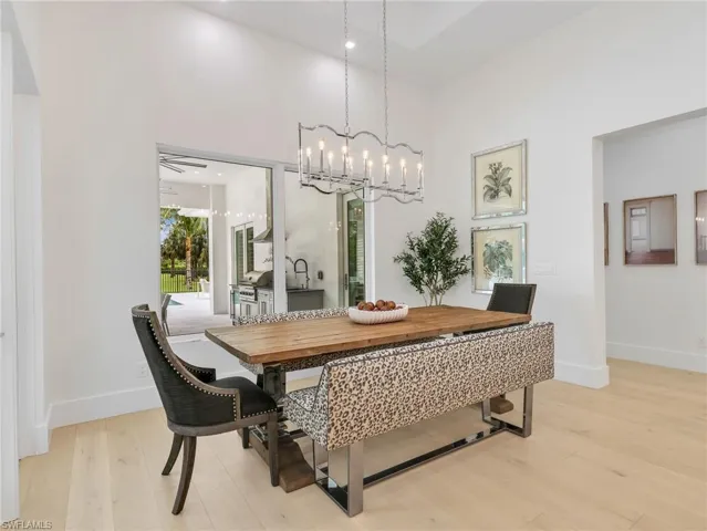 Spacious breakfast area featuring contemporary chandelier, and high ceilings