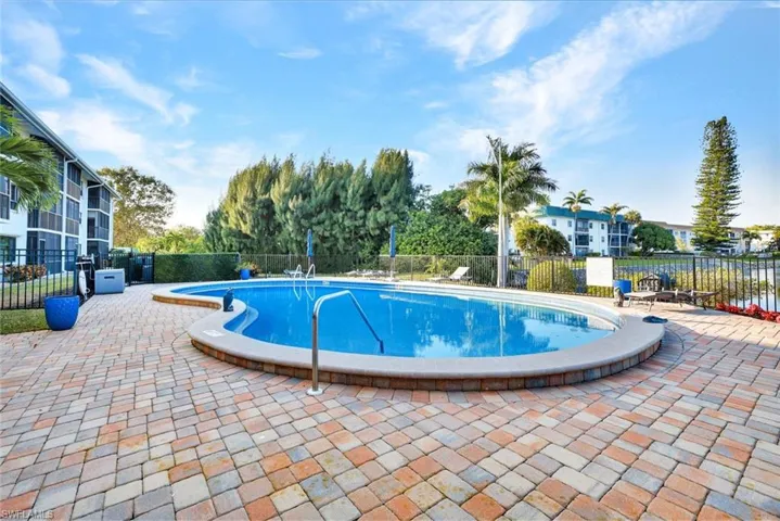 Community pool with a patio area