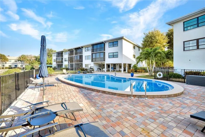 Community pool with a patio area