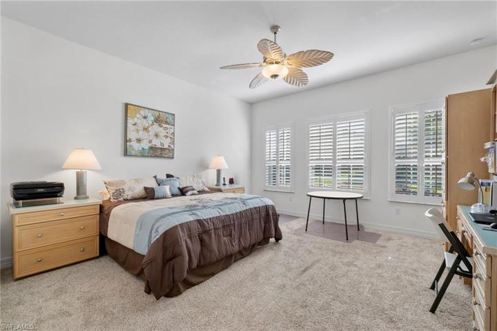 2nd master bedroom with a southern exposure and plantation shutters.