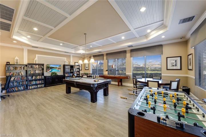 Marbella Lakes game room with a library.