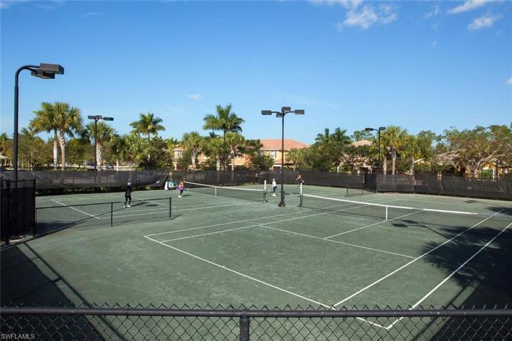 Neighbors having fun playing tennis.