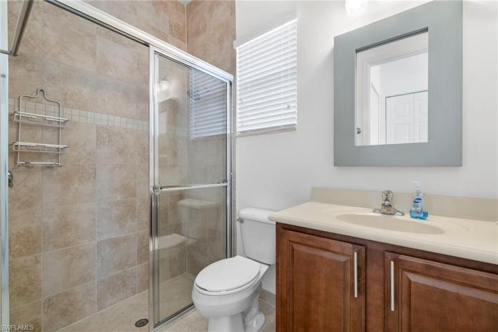 2nd master bath is tiled and has a window!