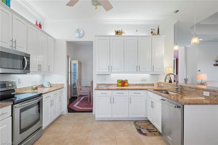 The kitchen is open to the formal dining room. Great for family dinners.