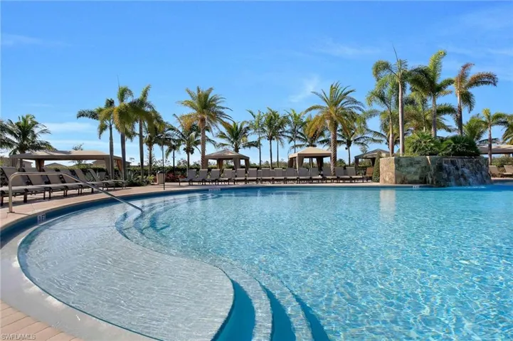View of swimming pool with pool water feature and a gazebo