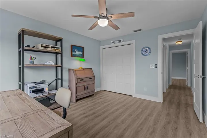 Office area featuring ceiling fan and light hardwood / wood-style floors