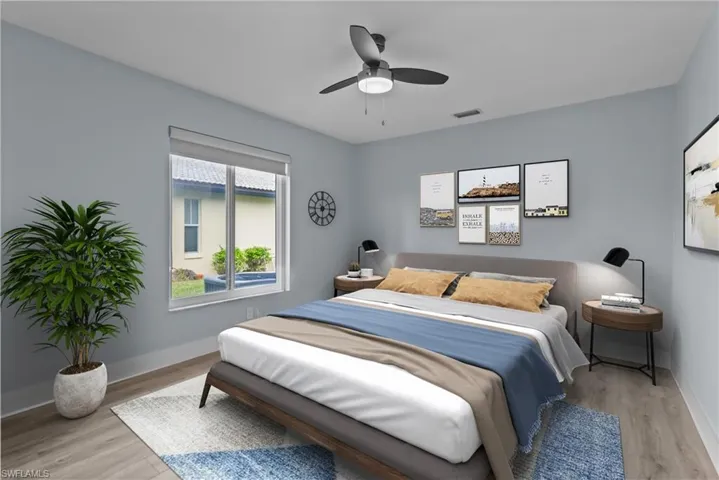 Bedroom featuring light hardwood / wood-style flooring and ceiling fan