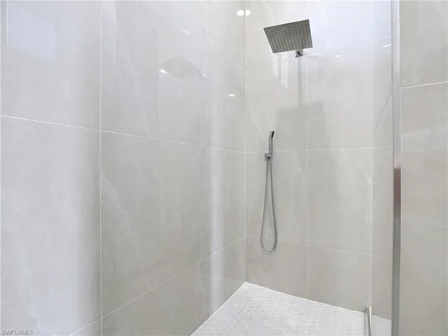 Full bathroom featuring tiled shower