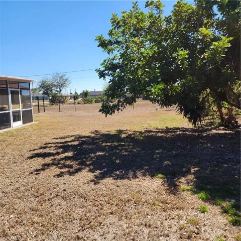 View of yard with a sunroom