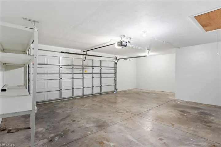 Garage featuring a garage door opener