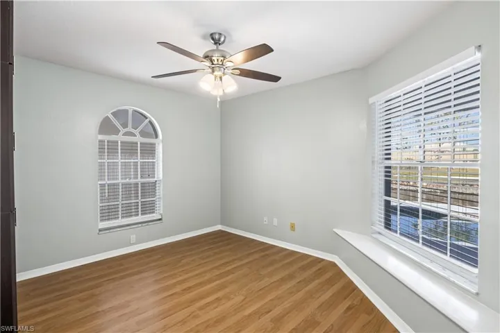 Spare room featuring ceiling fan and wood-type flooring