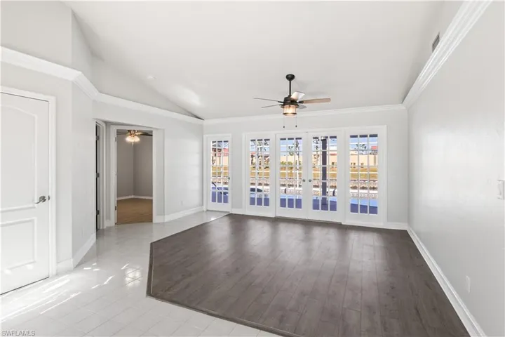 Family room with ceiling fan, light hardwood / wood-style floors, and ornamental molding